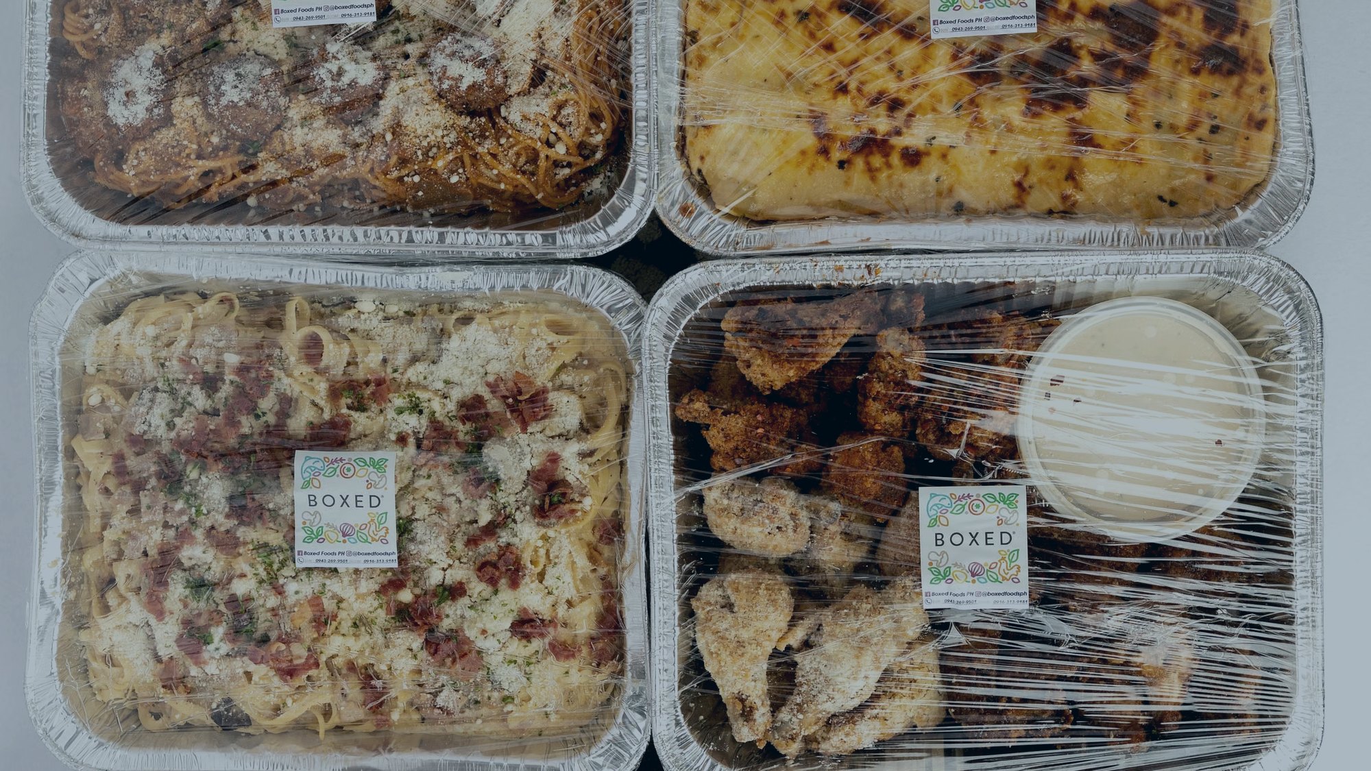 Retort pouches of ready-to-eat food moving along a filling line