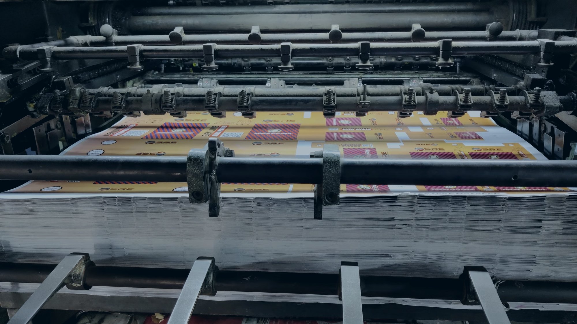Rolls of printed flexible packaging film leaving a Global Flex press